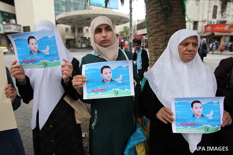 Palestinian journalists take part in a protest demanding the released for their colleague, Tareq Abu Zaid, the Journalist of Al-Aqsa TV, detained by Palestinian Authority, in the West bank city of Nablus, on May 24, 2016...