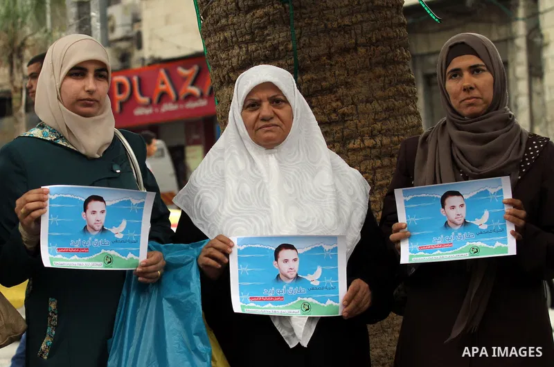 Palestinian journalists take part in a protest demanding the released for their colleague, Tareq Abu Zaid, the Journalist of Al-Aqsa TV, detained by Palestinian Authority, in the West bank city of Nablus, on May 24, 2016...