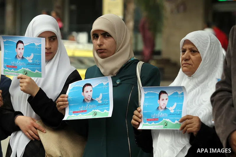 Palestinian journalists take part in a protest demanding the released for their colleague, Tareq Abu Zaid, the Journalist of Al-Aqsa TV, detained by Palestinian Authority, in the West bank city of Nablus, on May 24, 2016...