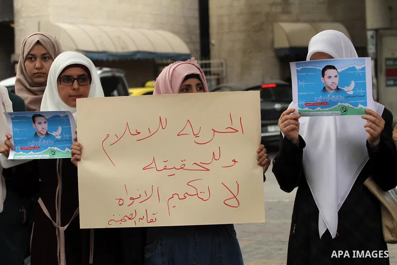 Palestinian journalists take part in a protest demanding the released for their colleague, Tareq Abu Zaid, the Journalist of Al-Aqsa TV, detained by Palestinian Authority, in the West bank city of Nablus, on May 24, 2016...