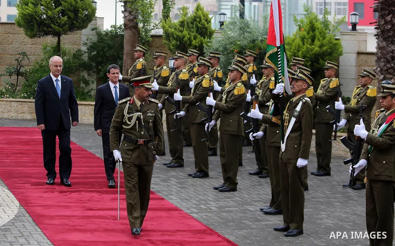 Palestinian Prime Minister Rami Hamdallah and French Prime Minister Manuel Valls, arrive for a meeting in the West Bank city of Ramallah, on May 24, 2016. Photo by Prime Minister Office