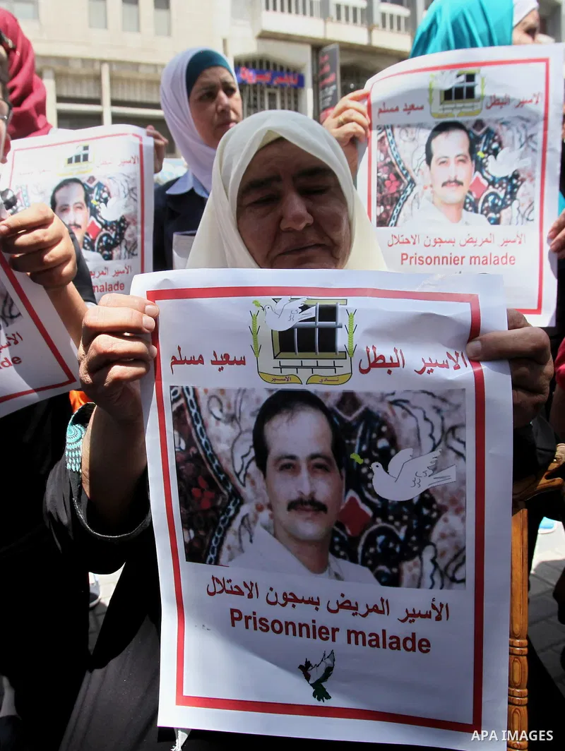 Palestinian relatives of patient prisoners in Israeli jails take part in a protest demanding for their release,in the West Bank city of Nablus on May 26, 2016. Photo by Nedal Eshtayah