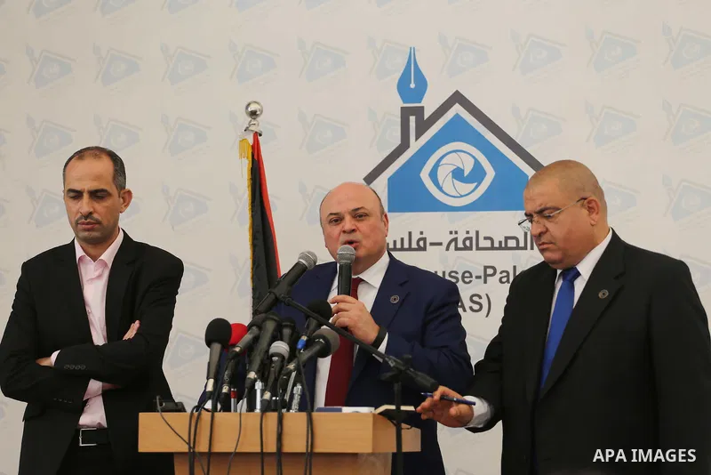 Azzam Shawwa, Governor of the Palestinian Monetary Authority, speaks during a press conference in Gaza city, on May 26, 2016. Photo by Mohammed Asad