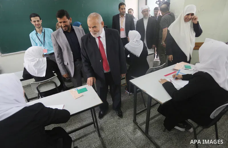 Deputy of the Legislative Council, Ahmed Bahar, visits a school during the first day of high school exams, known as "Tawjihi", in Gaza city on May 28, 2016. Nearly 78,000 Palestinian students sat for the first session of...