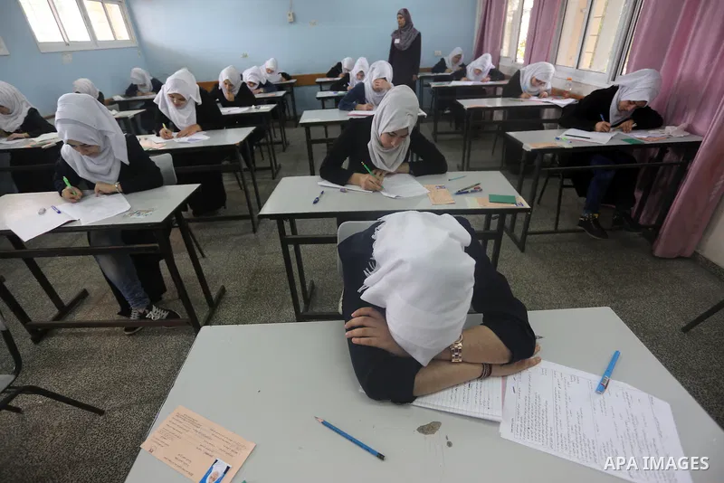Palestinian female students sit for their final high school exams, known as "Tawjihi", in Gaza city on May 28, 2016. Nearly 78,000 Palestinian students sat for the first session of their high school exams seeking to obta...