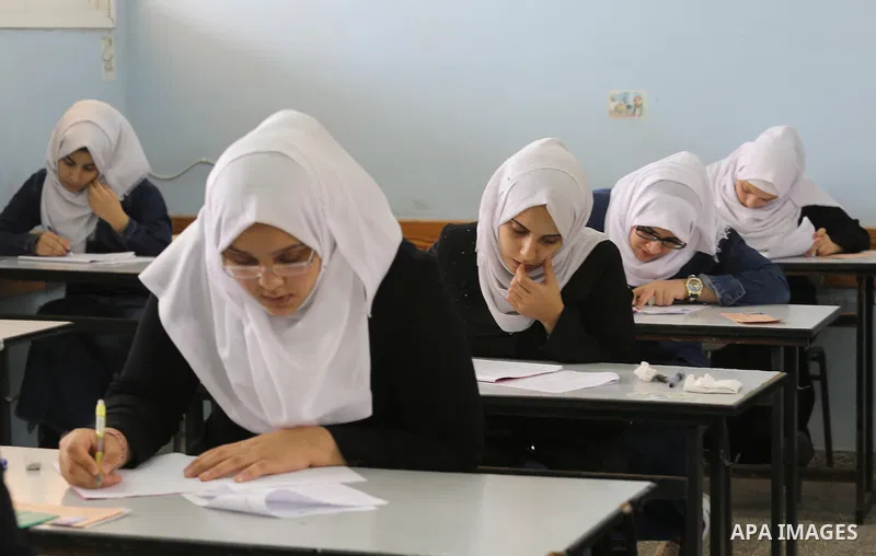 Palestinian female students sit for their final high school exams, known as "Tawjihi", in Gaza city on May 28, 2016. Nearly 78,000 Palestinian students sat for the first session of their high school exams seeking to obta...