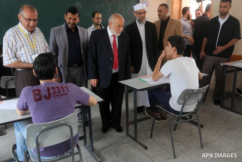 Deputy of the Legislative Council, Ahmed Bahar, visits a school during the first day of high school exams, known as "Tawjihi", in Gaza city on May 28, 2016. Nearly 78,000 Palestinian students sat for the first session of...