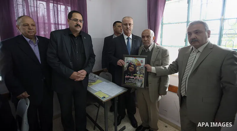 Palestinian Prime Minister Rami Hamdallah visits a school during the first day of high school exams, known as "Tawjihi",In Jerusalem, on May 28, 2016. Nearly 78,000 Palestinian students sat for the first session of their...