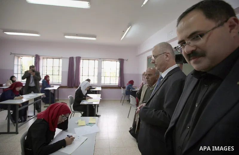 Palestinian Prime Minister Rami Hamdallah visits a school during the first day of high school exams, known as "Tawjihi",In Jerusalem, on May 28, 2016. Nearly 78,000 Palestinian students sat for the first session of their...