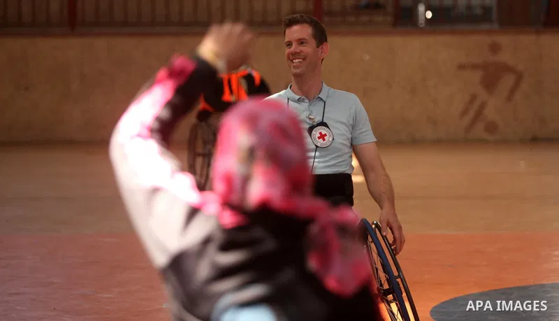 An American coach Jess marc, trains disabled Palestinians to play a basketball during a training course organised by the Palestinian Red Cross, in Khan Younis in the southern Gaza strip, on May 28, 2016. Photo by Ashraf...