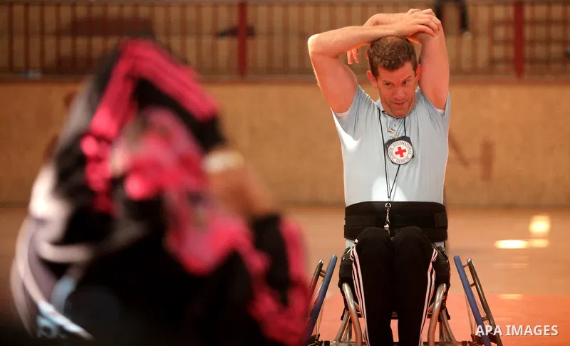 An American coach Jess marc, trains disabled Palestinians to play a basketball during a training course organised by the Palestinian Red Cross, in Khan Younis in the southern Gaza strip, on May 28, 2016. Photo by Ashraf...
