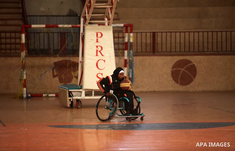 Disabled Palestinians take part in a training course to play basketball organised by the Palestinian Red Cross, in Khan Younis in the southern Gaza strip, on May 28, 2016. Photo by Ashraf Amra