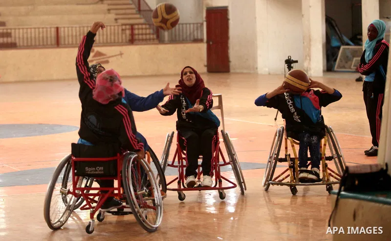 Disabled Palestinians take part in a training course to play basketball organised by the Palestinian Red Cross, in Khan Younis in the southern Gaza strip, on May 28, 2016. Photo by Ashraf Amra