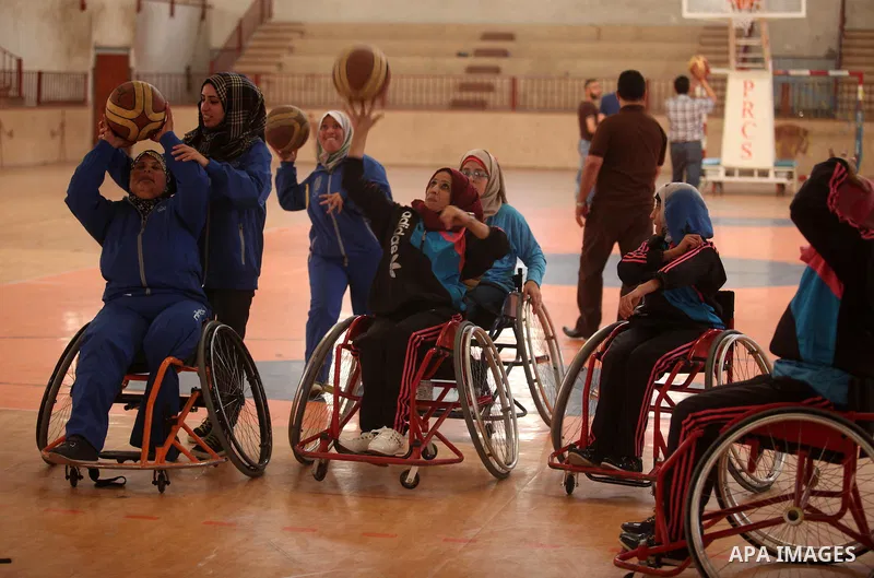 Disabled Palestinians take part in a training course to play basketball organised by the Palestinian Red Cross, in Khan Younis in the southern Gaza strip, on May 28, 2016. Photo by Ashraf Amra