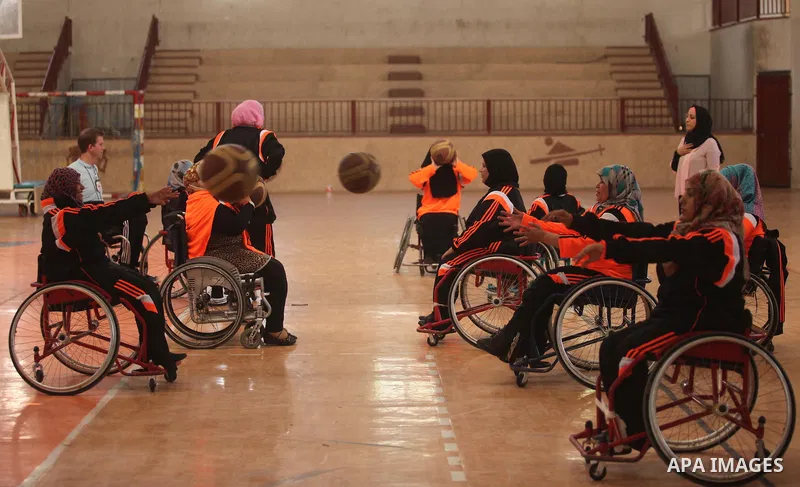 Disabled Palestinians take part in a training course to play basketball organised by the Palestinian Red Cross, in Khan Younis in the southern Gaza strip, on May 28, 2016. Photo by Ashraf Amra