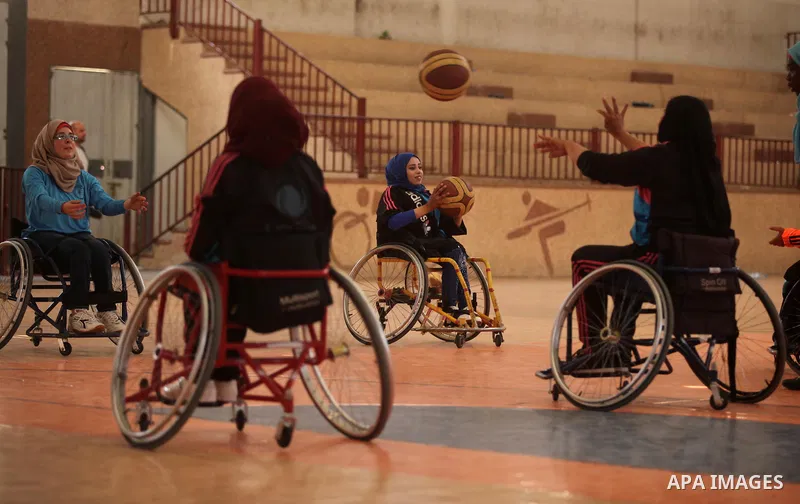 Disabled Palestinians take part in a training course to play basketball organised by the Palestinian Red Cross, in Khan Younis in the southern Gaza strip, on May 28, 2016. Photo by Ashraf Amra