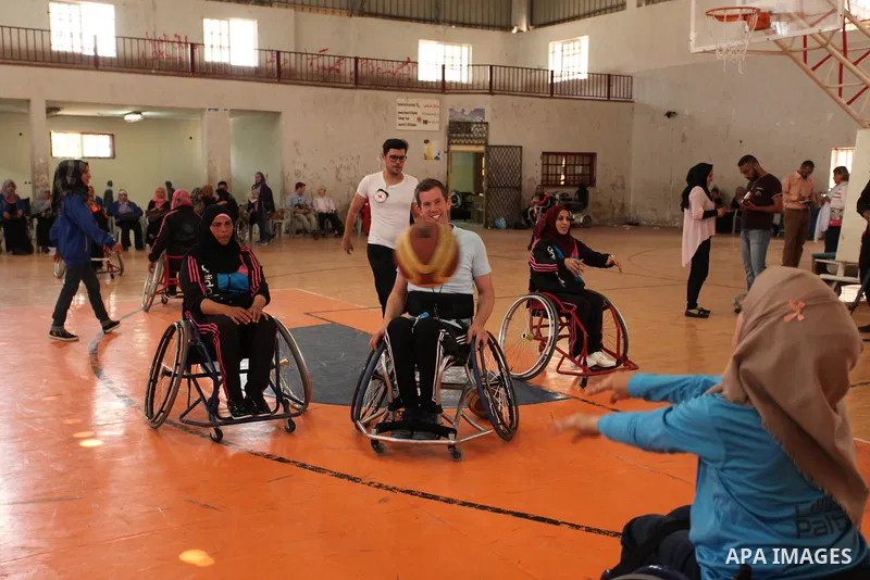 Disabled Palestinians take part in a training course to play basketball organised by the Palestinian Red Cross, in Khan Younis in the southern Gaza strip, on May 28, 2016. Photo by Ashraf Amra