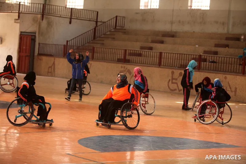 Disabled Palestinians take part in a training course to play basketball organised by the Palestinian Red Cross, in Khan Younis in the southern Gaza strip, on May 28, 2016. Photo by Ashraf Amra