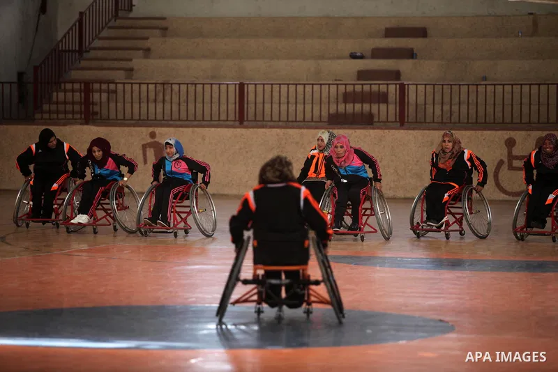 Disabled Palestinians take part in a training course to play basketball organised by the Palestinian Red Cross, in Khan Younis in the southern Gaza strip, on May 28, 2016. Photo by Ashraf Amra