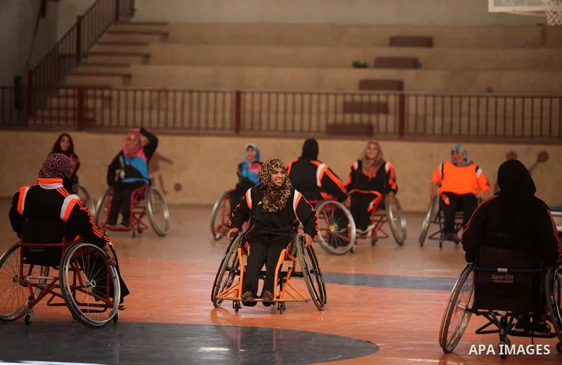 Disabled Palestinians take part in a training course to play basketball organised by the Palestinian Red Cross, in Khan Younis in the southern Gaza strip, on May 28, 2016. Photo by Ashraf Amra