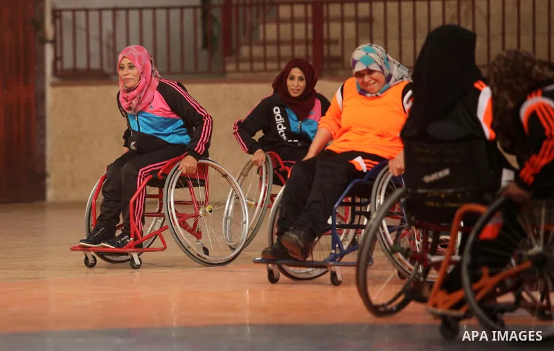Disabled Palestinians take part in a training course to play basketball organised by the Palestinian Red Cross, in Khan Younis in the southern Gaza strip, on May 28, 2016. Photo by Ashraf Amra