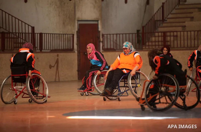 Disabled Palestinians take part in a training course to play basketball organised by the Palestinian Red Cross, in Khan Younis in the southern Gaza strip, on May 28, 2016. Photo by Ashraf Amra