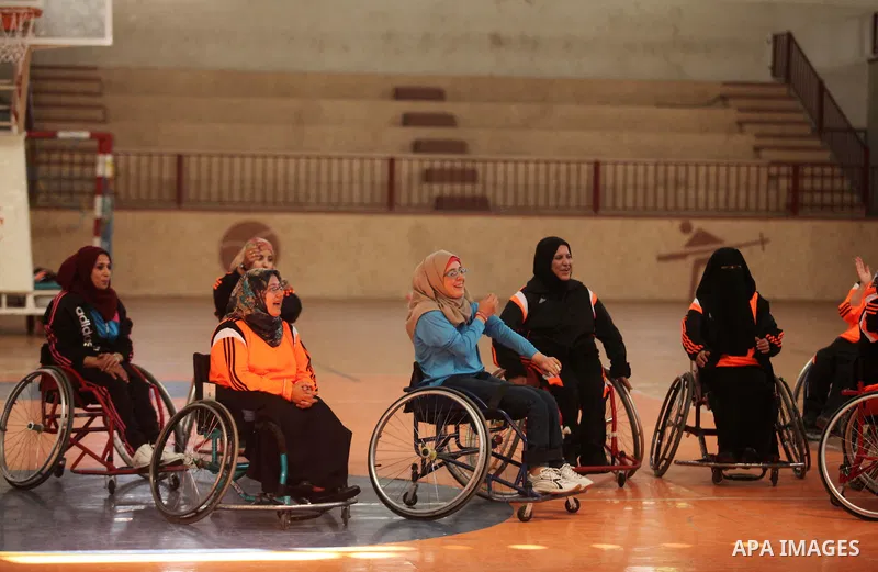 Disabled Palestinians take part in a training course to play basketball organised by the Palestinian Red Cross, in Khan Younis in the southern Gaza strip, on May 28, 2016. Photo by Ashraf Amra