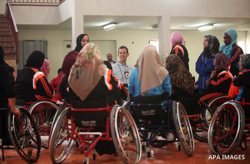 An American coach Jess marc, trains disabled Palestinians to play a basketball during a training course organised by the Palestinian Red Cross, in Khan Younis in the southern Gaza strip, on May 28, 2016. Photo by Ashraf...
