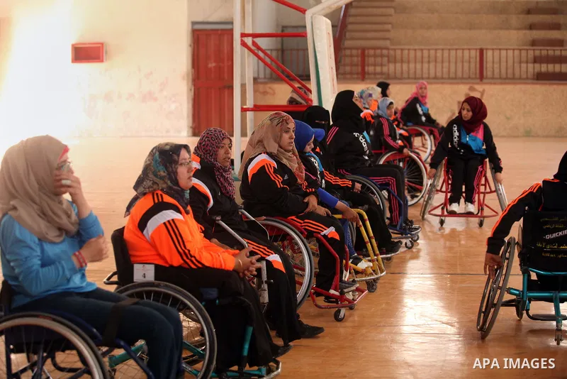 Disabled Palestinians take part in a training course to play basketball organised by the Palestinian Red Cross in Khan Younis in the southern Gaza strip, on May 28, 2016. Photo by Ashraf Amra