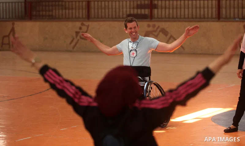 An American coach Jess marc, trains disabled Palestinians to play a basketball during a training course organised by the Palestinian Red Cross, in Khan Younis in the southern Gaza strip, on May 28, 2016. Photo by Ashraf...