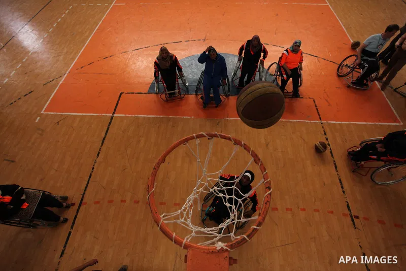 Disabled Palestinians take part in a training course to play basketball organised by the Palestinian Red Cross in Khan Younis in the southern Gaza strip, on May 28, 2016. Photo by Ashraf Amra