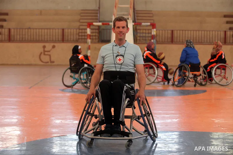 An American coach Jess marc, trains disabled Palestinians to play a basketball during a training course organised by the Palestinian Red Cross, in Khan Younis in the southern Gaza strip, on May 28, 2016. Photo by Ashraf...