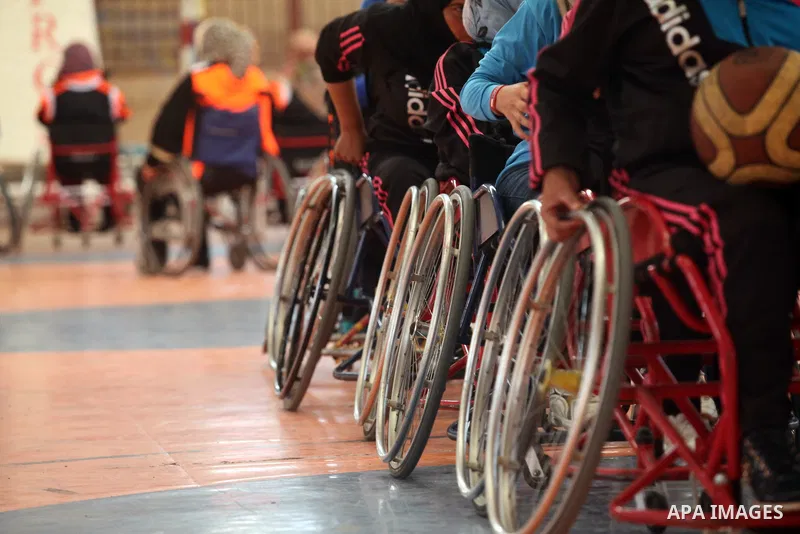 Disabled Palestinians take part in a training course to play basketball organised by the Palestinian Red Cross in Khan Younis in the southern Gaza strip, on May 28, 2016. Photo by Ashraf Amra
