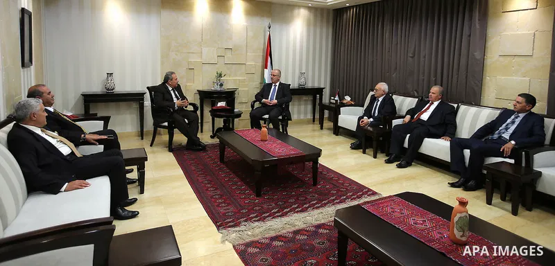 Palestinian Prime Minister, Rami Hamdallah, meet with, Constitutional Court Chairman Mohammed Alhaji Qasim, in the West Bank city of Ramallah, on May 29, 2016. Photo by Prime Minister Office