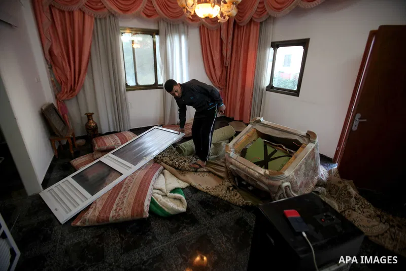 Palestinians inspect their room after the Israeli soldiers raided their family house, at Salem village near the West Bank city of Nablus, on May 30, 2016. Photo by Nedal Eshtayah