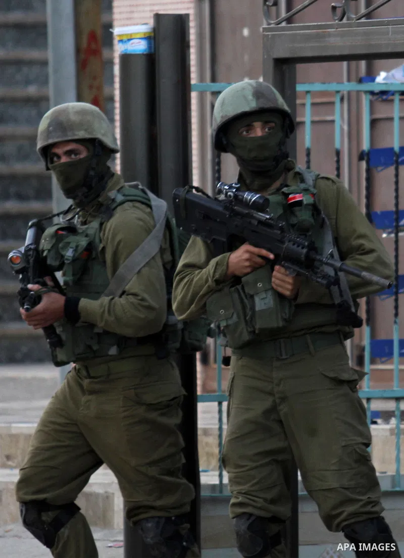 Israeli soldiers patrol a street, at Salem village near the West Bank city of Nablus, on May 30, 2016. Photo by Nedal Eshtayah