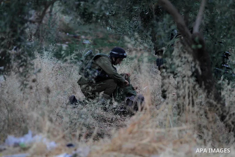 Israeli soldiers patrol a street, at Salem village near the West Bank city of Nablus, on May 30, 2016. Photo by Nedal Eshtayah