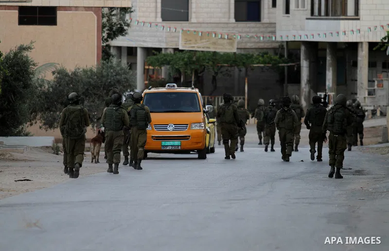 Israeli soldiers patrol a street, at Salem village near the West Bank city of Nablus, on May 30, 2016. Photo by Nedal Eshtayah