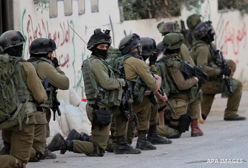 Israeli soldiers patrol a street, at Salem village near the West Bank city of Nablus, on May 30, 2016. Photo by Nedal Eshtayah