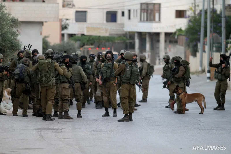 Israeli soldiers patrol a street, at Salem village near the West Bank city of Nablus, on May 30, 2016. Photo by Nedal Eshtayah
