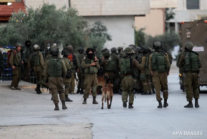 Israeli soldiers patrol a street, at Salem village near the West Bank city of Nablus, on May 30, 2016. Photo by Nedal Eshtayah
