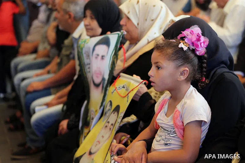 Palestinians take part in a protest demanding release the prisoners in Israeli jails, in front of Red cross office, in Gaza city, on May 30, 2016. Photo by Mohammed Asad