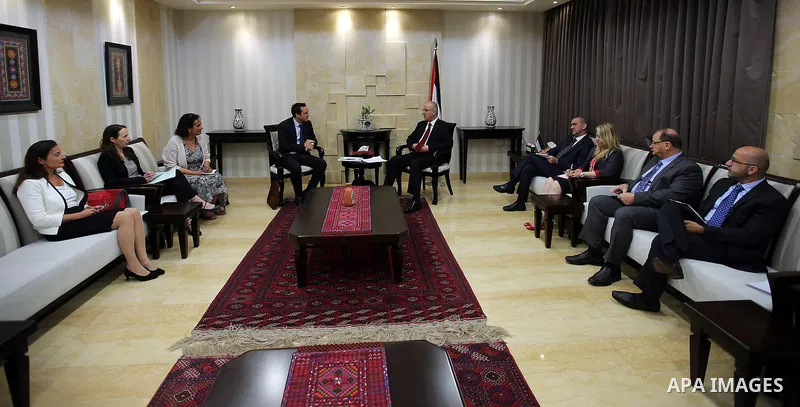 Palestinian Prime Minister Rami Hamdallah meets with a head of the Red Cross mission to Palestine, in the West Bank city of Ramallah, on May 30, 2016.. Photo by Prime Minister Office