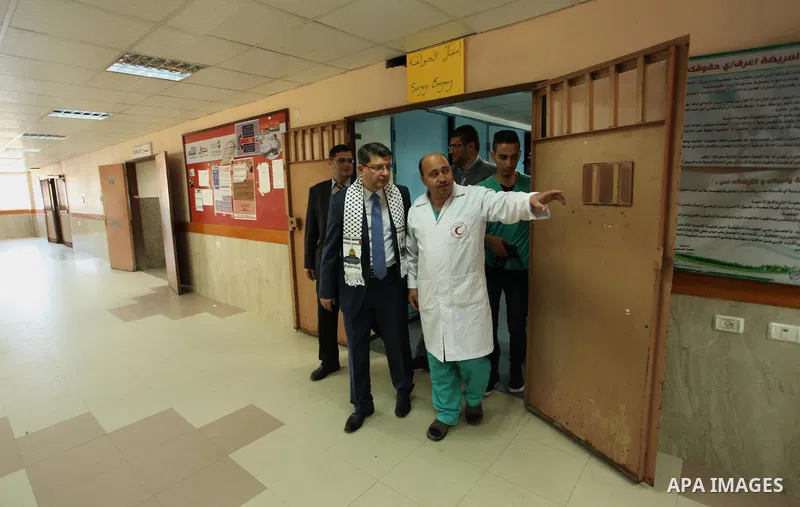 Turkish Consul, Mustafa Sarnic with Gerald Rockenschaub, Head of the WHO office in the occupied Palestinian territories visit al-Shifa hospital in Gaza City, on May 30, 2016. Photo by Ashraf Amra