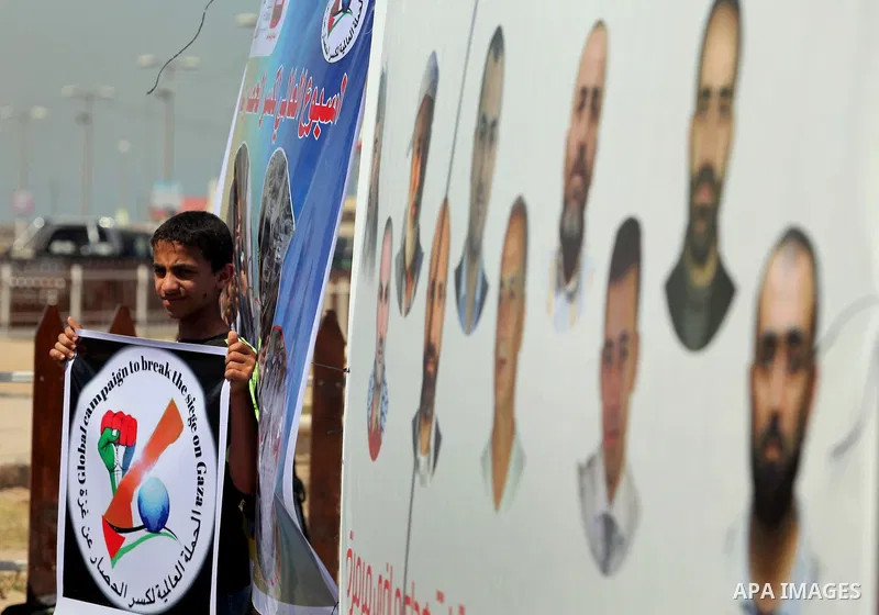 Palestinians hold flags during a rally marking the 6th anniversary of the Mavi Marmara Gaza flotilla incident, at the seaport of Gaza City May 31, 2016. Nine activists, eight Turkish and one Turkish-American, died on May...