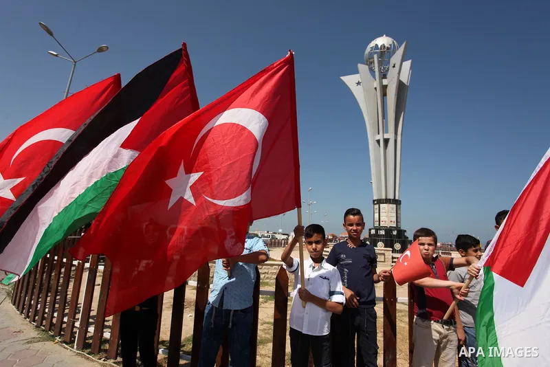 Palestinians hold flags during a rally marking the 6th anniversary of the Mavi Marmara Gaza flotilla incident, at the seaport of Gaza City May 31, 2016. Nine activists, eight Turkish and one Turkish-American, died on May...