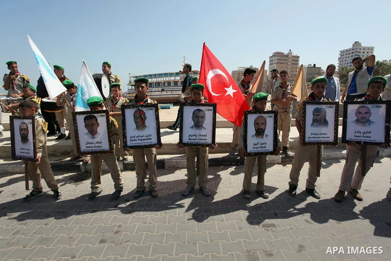 Palestinians hold flags during a rally marking the 6th anniversary of the Mavi Marmara Gaza flotilla incident, at the seaport of Gaza City May 31, 2016. Nine activists, eight Turkish and one Turkish-American, died on May...