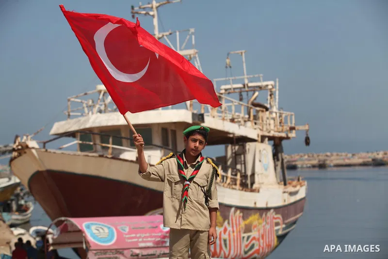Palestinians hold flags during a rally marking the 6th anniversary of the Mavi Marmara Gaza flotilla incident, at the seaport of Gaza City May 31, 2016. Nine activists, eight Turkish and one Turkish-American, died on May...