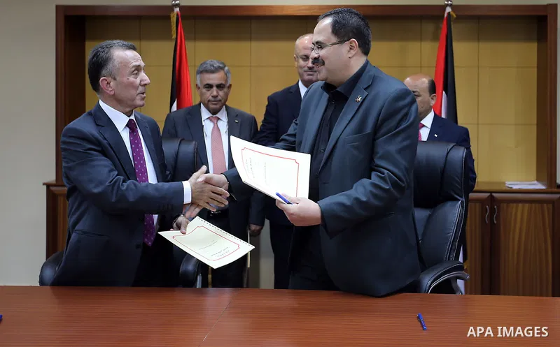 Palestinian Prime minister Rami Hamdallah attends the Signing an agreement between the Ministries of Local Government and Education and Islamic Bank, in the West bank city of Ramallah on May 31, 2016. Photo by Prime Mini...