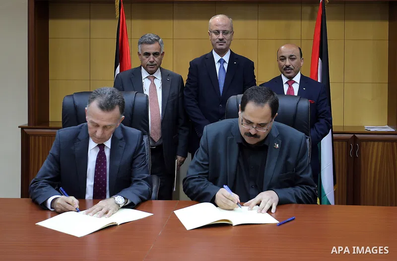 Palestinian Prime minister Rami Hamdallah attends the Signing an agreement between the Ministries of Local Government and Education and Islamic Bank, in the West bank city of Ramallah on May 31, 2016. Photo by Prime Mini...